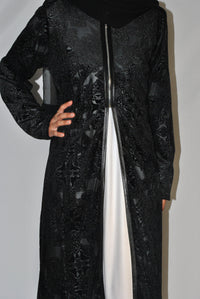 Black velvet overcoat with embossed floral patterns and front zipper, modest fashion