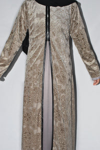 Elegant cream velvet overcoat with intricate embossed patterns and black trim detailing.