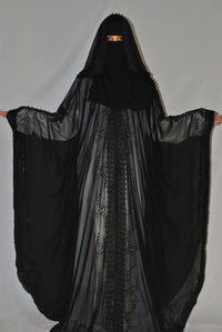 Black chiffon overcoat with lace and stonework detailing, modest fashion