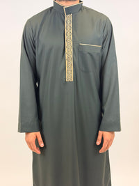Dark green traditional outfit with gold embroidery on a white background