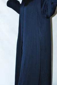 Navy blue open everyday abaya made from premium nida fabric, displayed on a hanger
