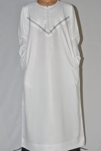 White embroidery detail on boys Omani thobe