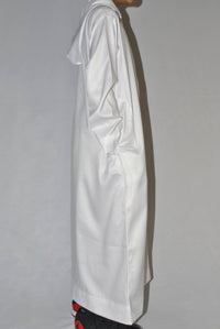 Side view of boys white hooded thobe