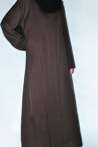 Brown everyday open abaya made from premium nida fabric, side view on plain background