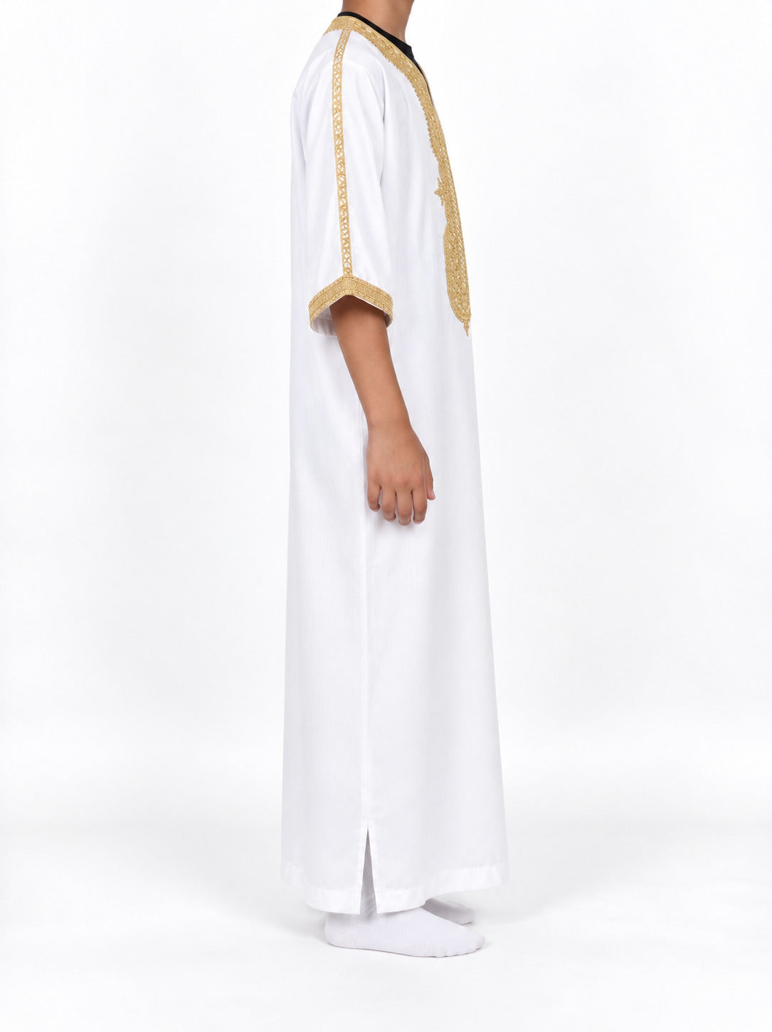 Side view of a boy wearing a white Moroccan thobe with gold sleeve trim and sleeves extending below the elbows