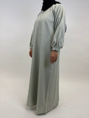 Neckline detail on women’s beige closed abaya